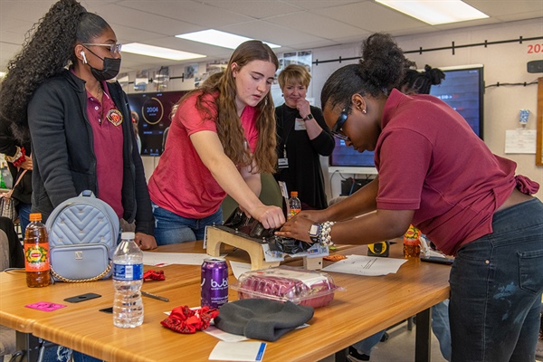 Students from two all-girls schools teamed up to build water-tight roofing structures, testing their critical thinking skills, teamwork and ability to adapt to change in a STEM construction workshop hosted by the Campus Renewal team.
