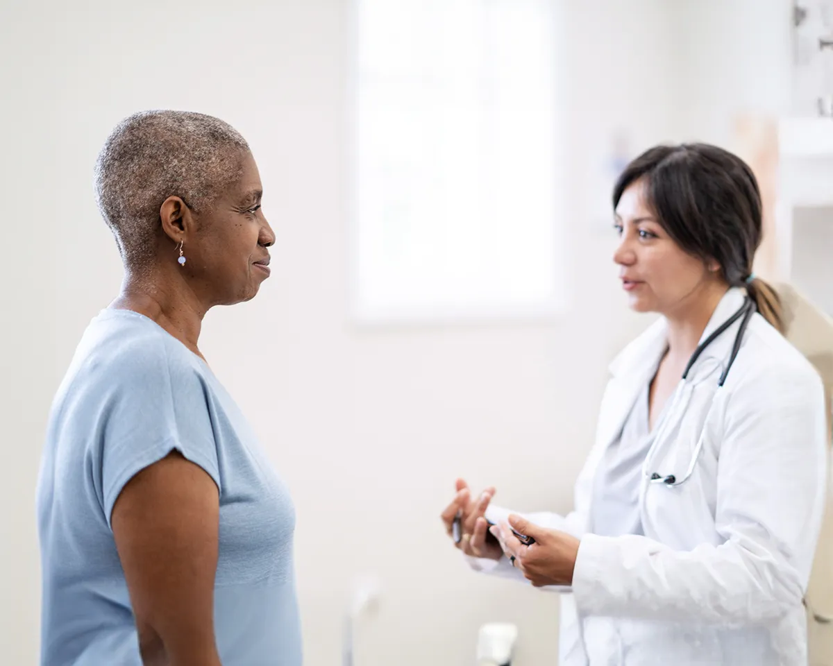 Doctor talking to woman patient