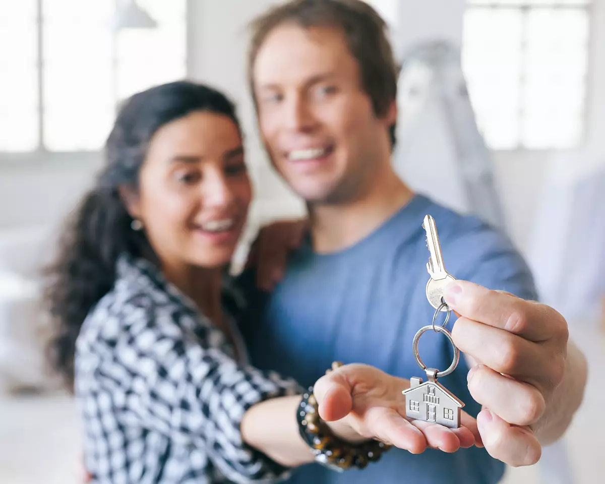 New homeowners holding a key