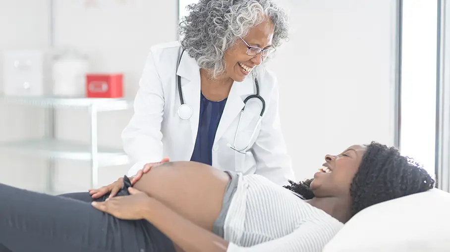 Pregnant woman and doctor in doctor's office