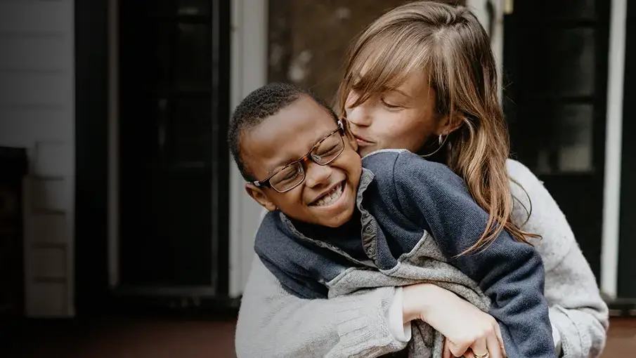 Woman hugging a child